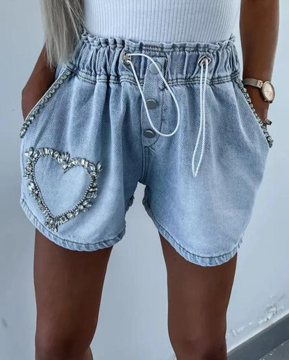 Shorts con corazón de strass