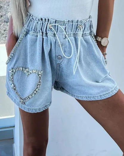 Shorts con corazón de strass