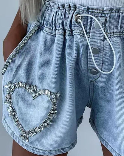 Shorts con corazón de strass